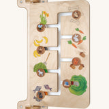 A closer look at one side of the Erzi Baby Animal Wallboard Game, showing an animal and their food matching game