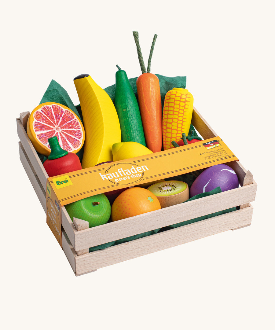 Erzi Wooden Assorted Fruits & Vegetables XL. A fantastic selection of large wooden fruits and vegetables, neatly inside a wooden Erzi crate. There is also a thin orange paper wrapping across the top of the crate