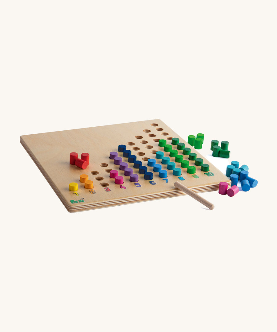 The Erzi Toys Counting Peg Board, showing the colourful pegs inside the cut out holes and next to the board.