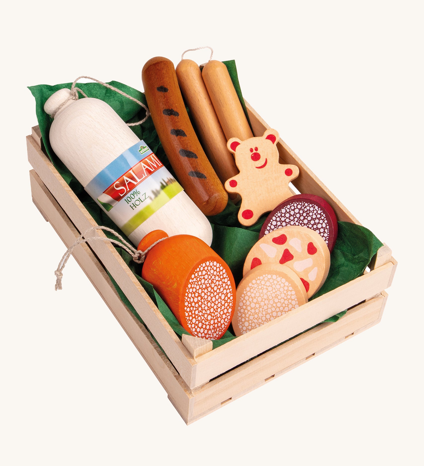 Erzi Wooden Assorted Sausages Play Food Set. A huge selection of play food sausages including different cuts of sausages, Salami, Wurst and Pepperoni together in a wooden Erzi crate lined with green paper. This would be a perfect set for playing cafes or shops!