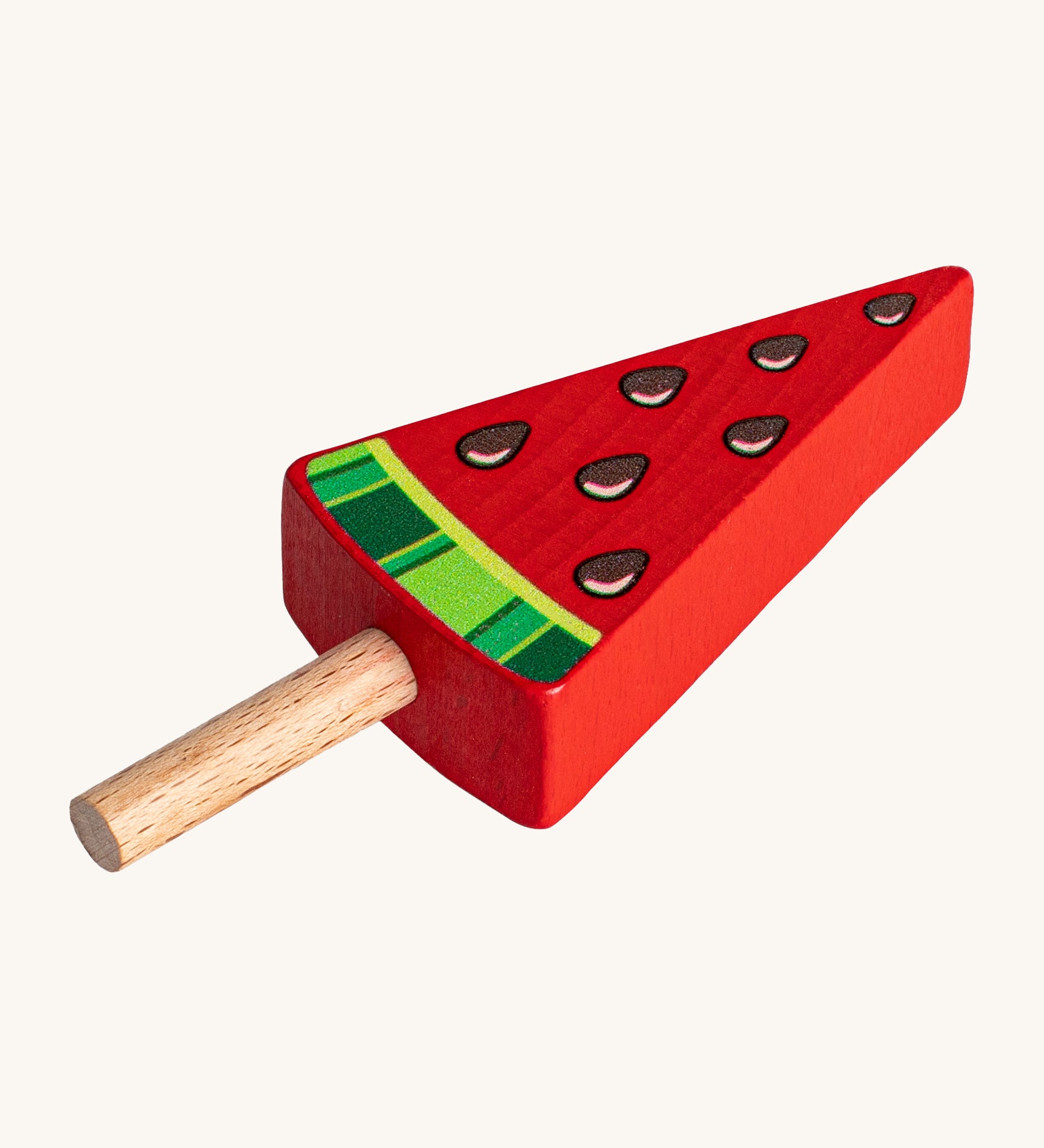 Erzi Wooden Melon Popsicle. A fun watermelon pretend play Popsicle, perfect for shop and cafe play! The popsicle is red with a natural wooden stick, watermelon seeds and green watermelon rind.