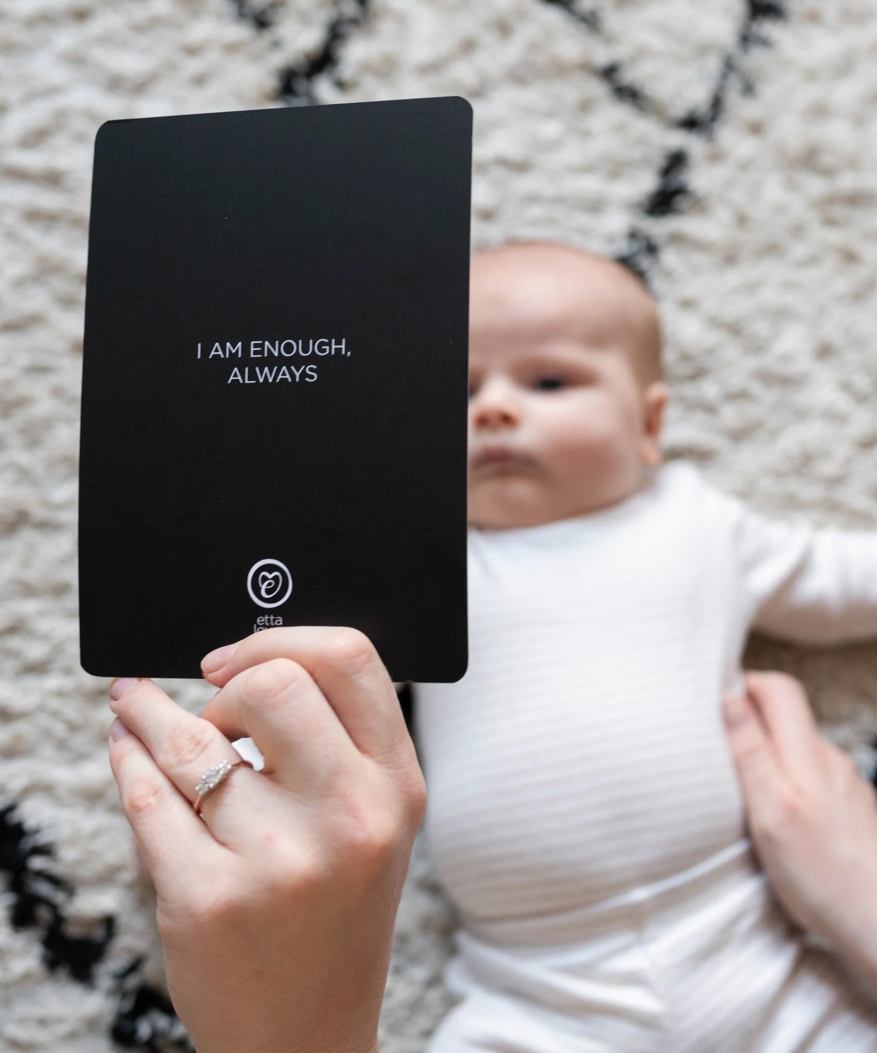 The Etta Loves Sensory Positive Affirmation Flash Cards, showing the Affirmation side of the card. The card reads "I am enough, always" and a baby is laying down looking at the visual side