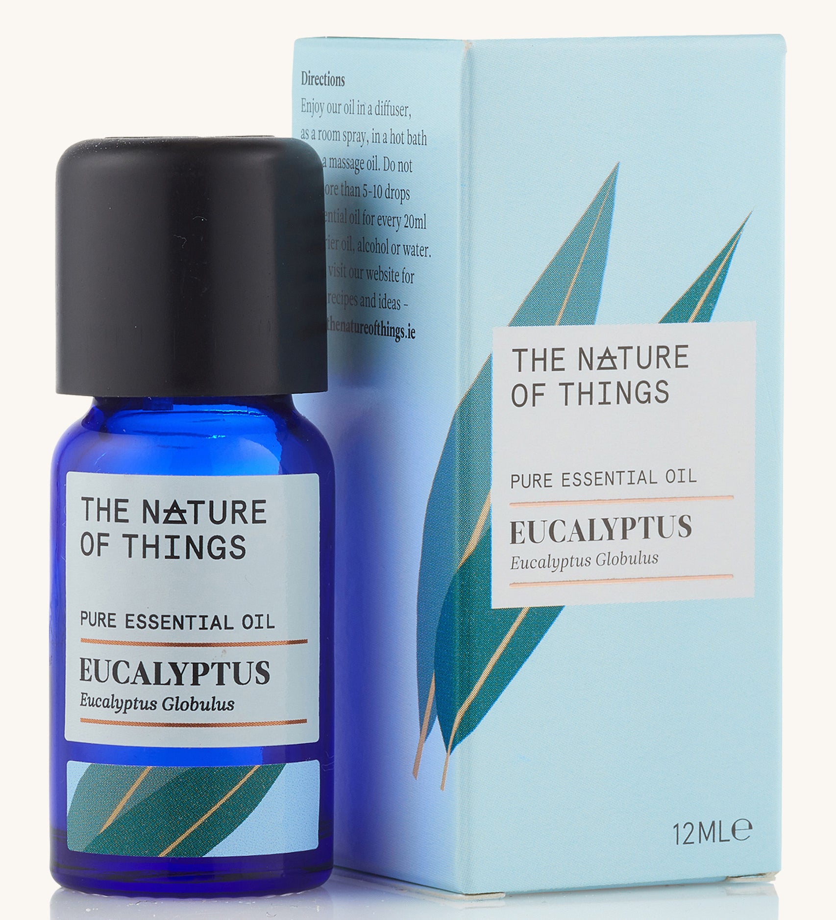 Organic Eucalyptus pure essential oil in a blue glass bottle in front of a decorative blue cardboard box.