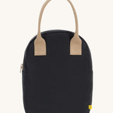 Fluf zip lunch bag in a solid black colour with a light brown handle on a cream background.