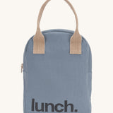 Fluf zip lunch bag in a light blue colour with a light brown handle and lunch logo on the bottom on a cream background.