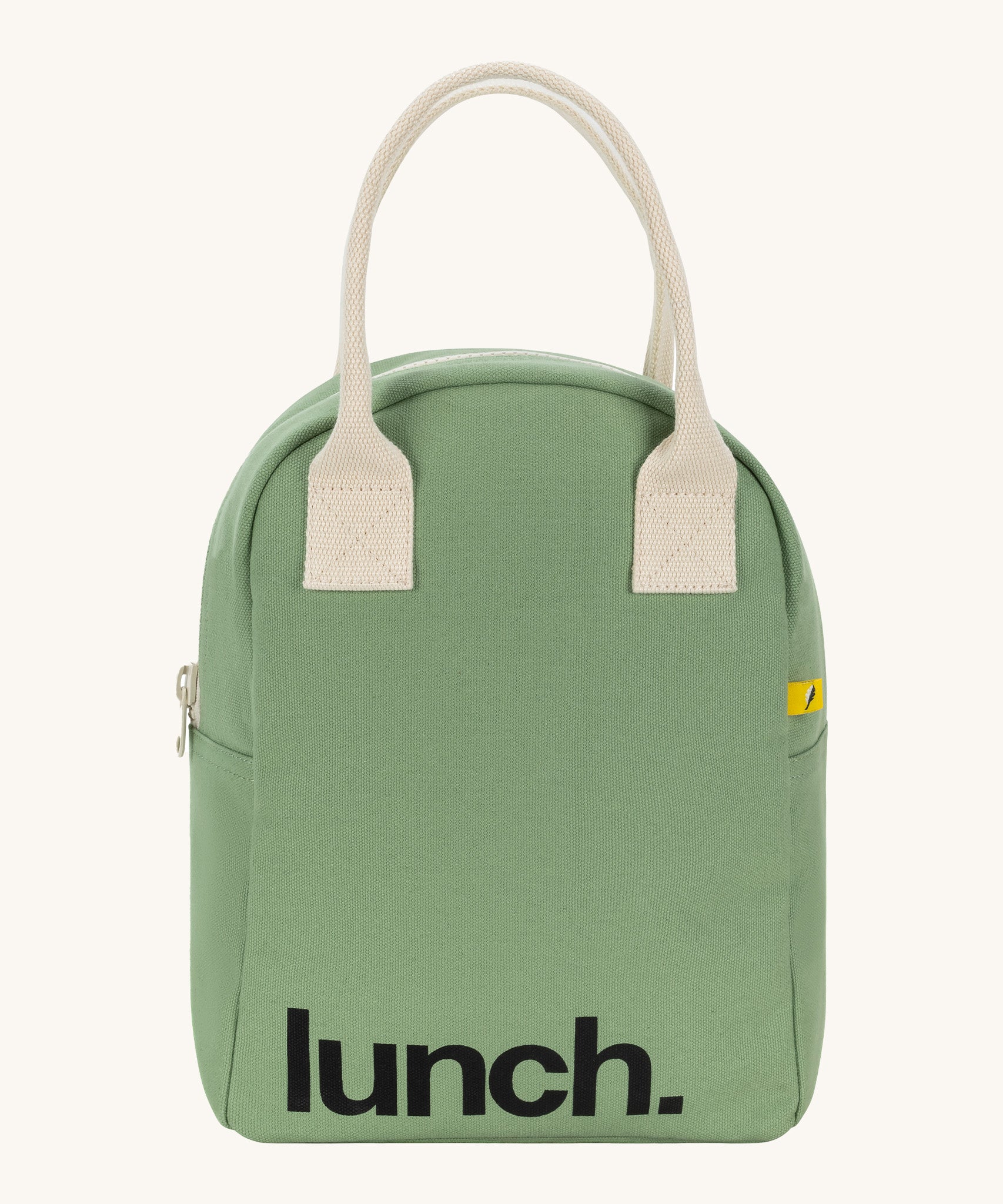 Fluf zip lunch bag in a light pastel green colour with a white handle and lunch logo on the bottom on a cream background.