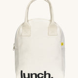 Fluf zip lunch bag in  white with lunch printed on the front in black with a white handle and zip detail on a cream background.