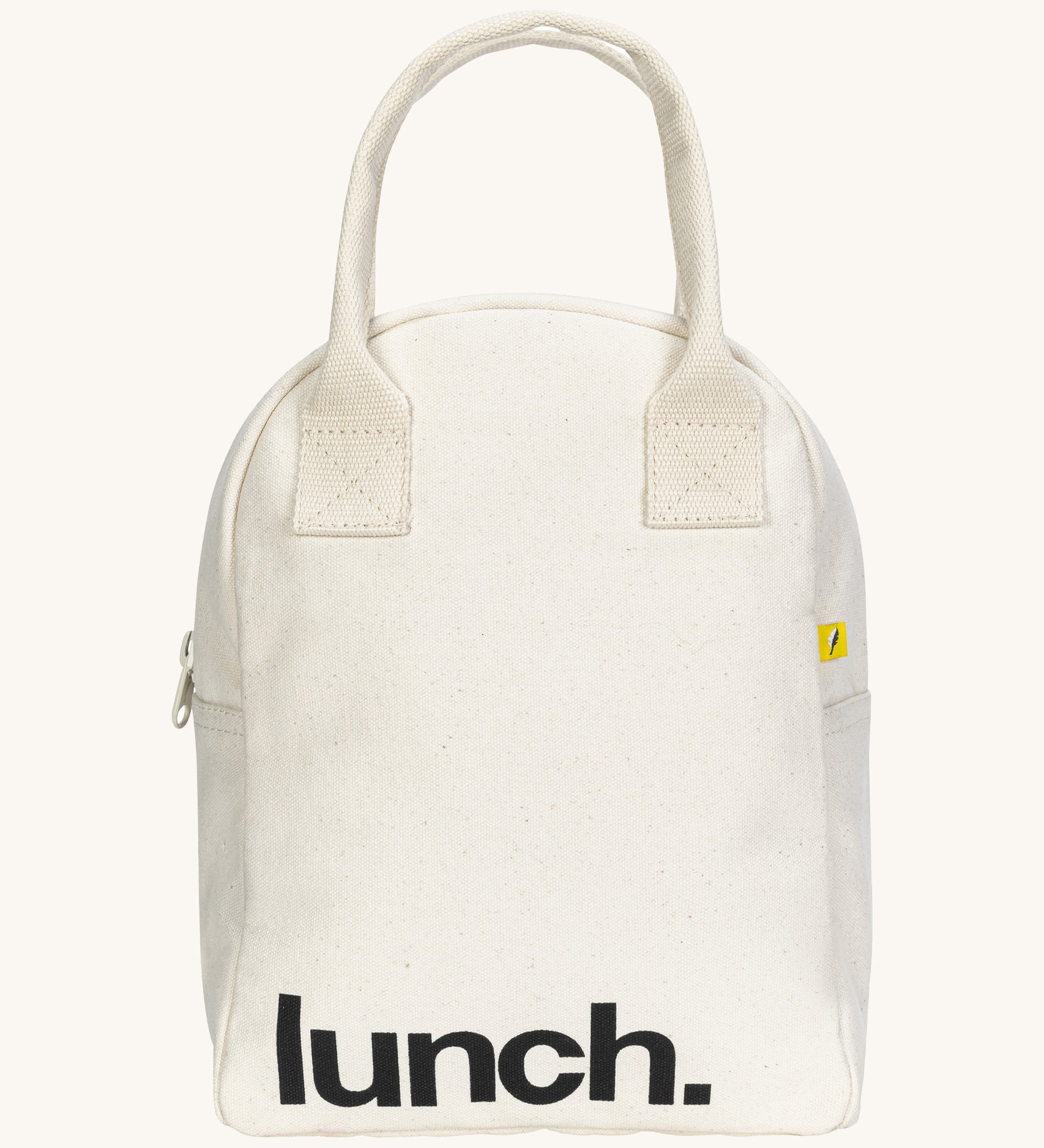 Fluf zip lunch bag in  white with lunch printed on the front in black with a white handle and zip detail on a cream background.