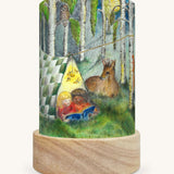 The Forest Whispers illustration by Eentje Van Margo sat in a Toverlux Magic Lantern base, on a cream background