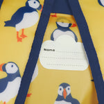 Frugi yellow dry bag puffin design name tag detail