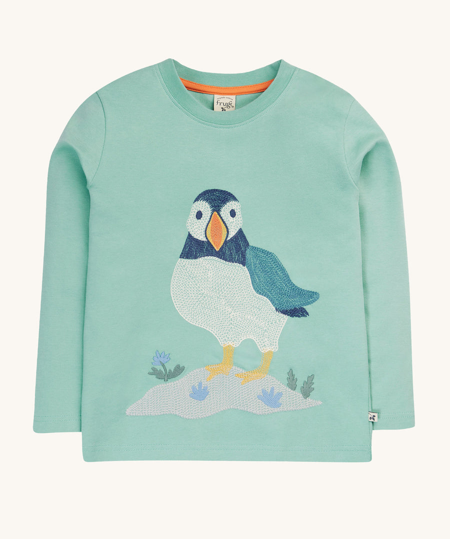 Frugi Adventure Embroidered Top - Moss/Puffin Stitch, in a pastel green colour and a large embroidered Frugi puffin on the front