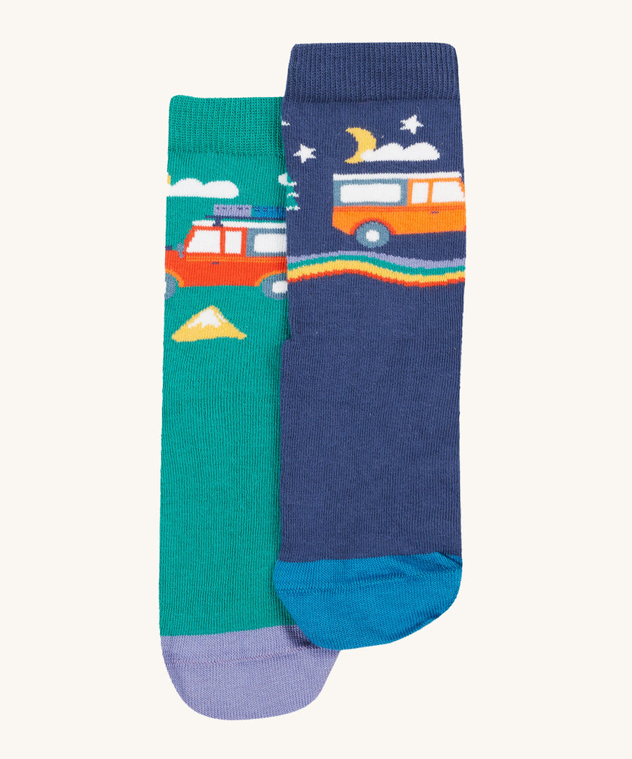 The camper van design on the Frugi Rock My Socks 3 Pack - Alpine Adventures. One is green and shows the daytime, one is Navy blue and shows the nighttime