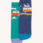 The camper van design on the Frugi Rock My Socks 3 Pack - Alpine Adventures. One is green and shows the daytime, one is Navy blue and shows the nighttime