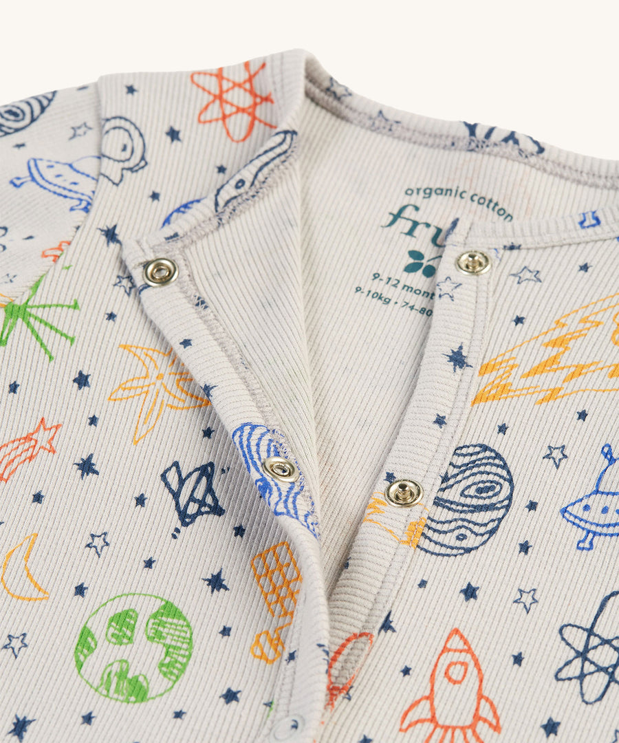 A closer look at the popper fastenings on the Frugi Rey Rib Baby Gift Set - Dream Big/Grey. The image shows the baby grow open and the inside is plain light grey. Also shown is the fun dream big print on the front of the babygrow