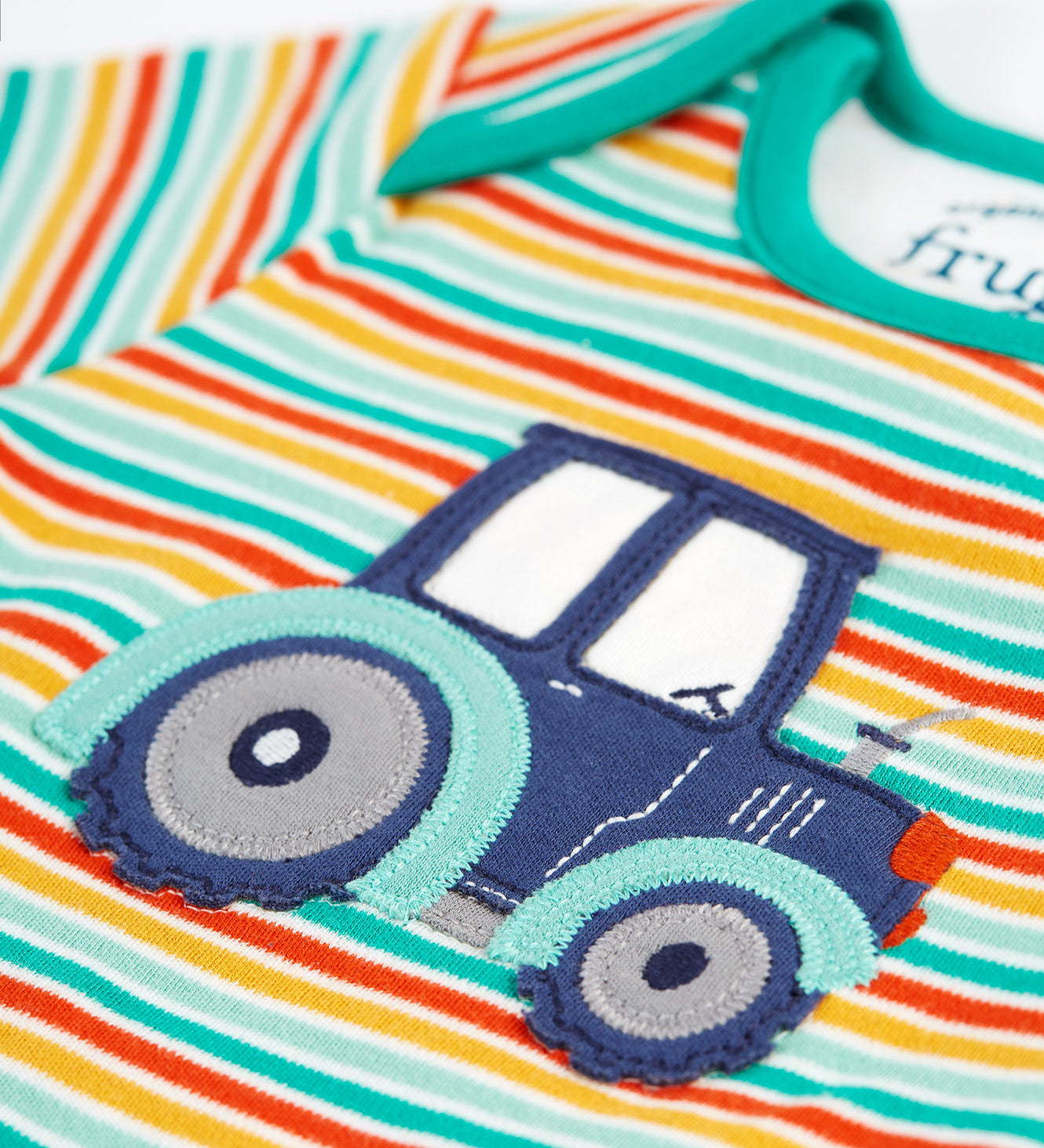 A closer look at the tractor applique on the front of the stripe top