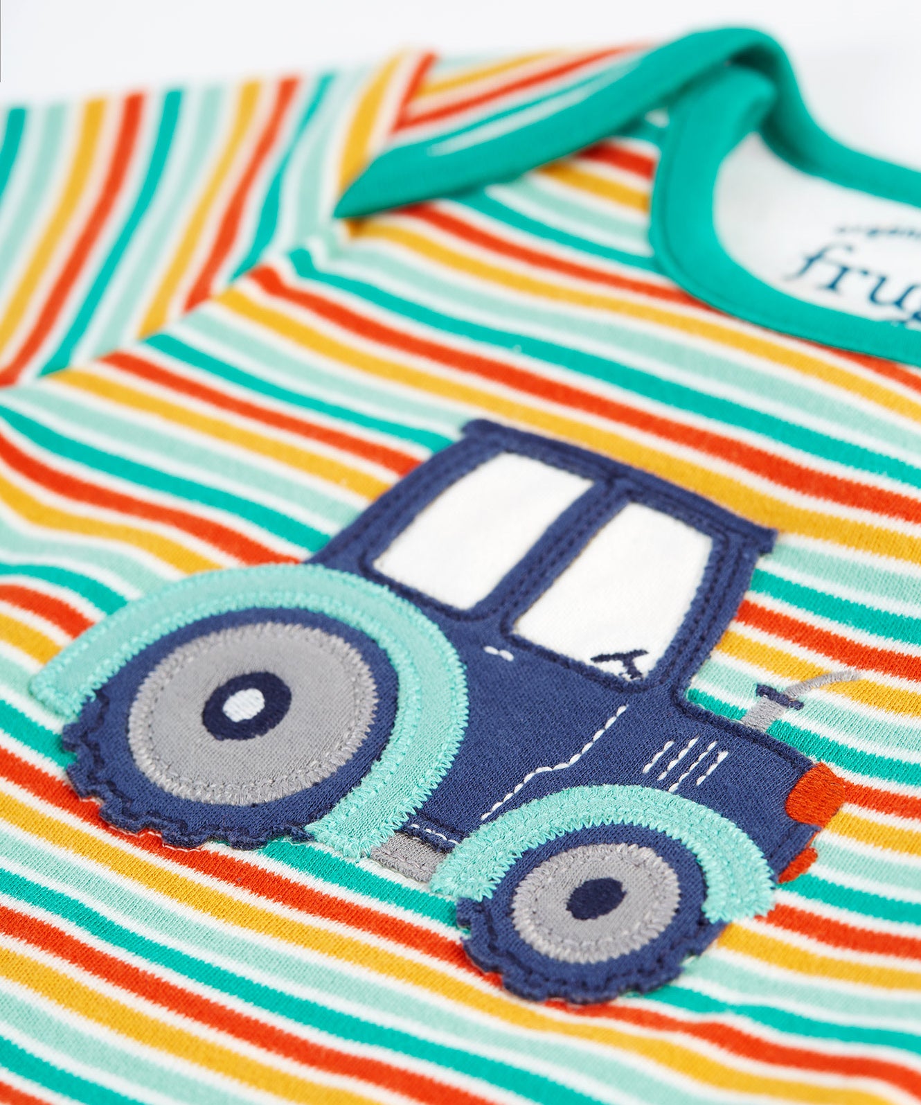 A closer look at the tractor applique on the front of the stripe top