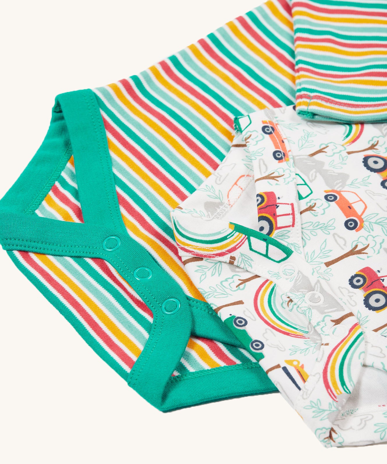 A look at the popper fasteners on the bottom of the Frugi Super Special 2 Pack Body - Let'S Go!/Iguana Multi Stripe