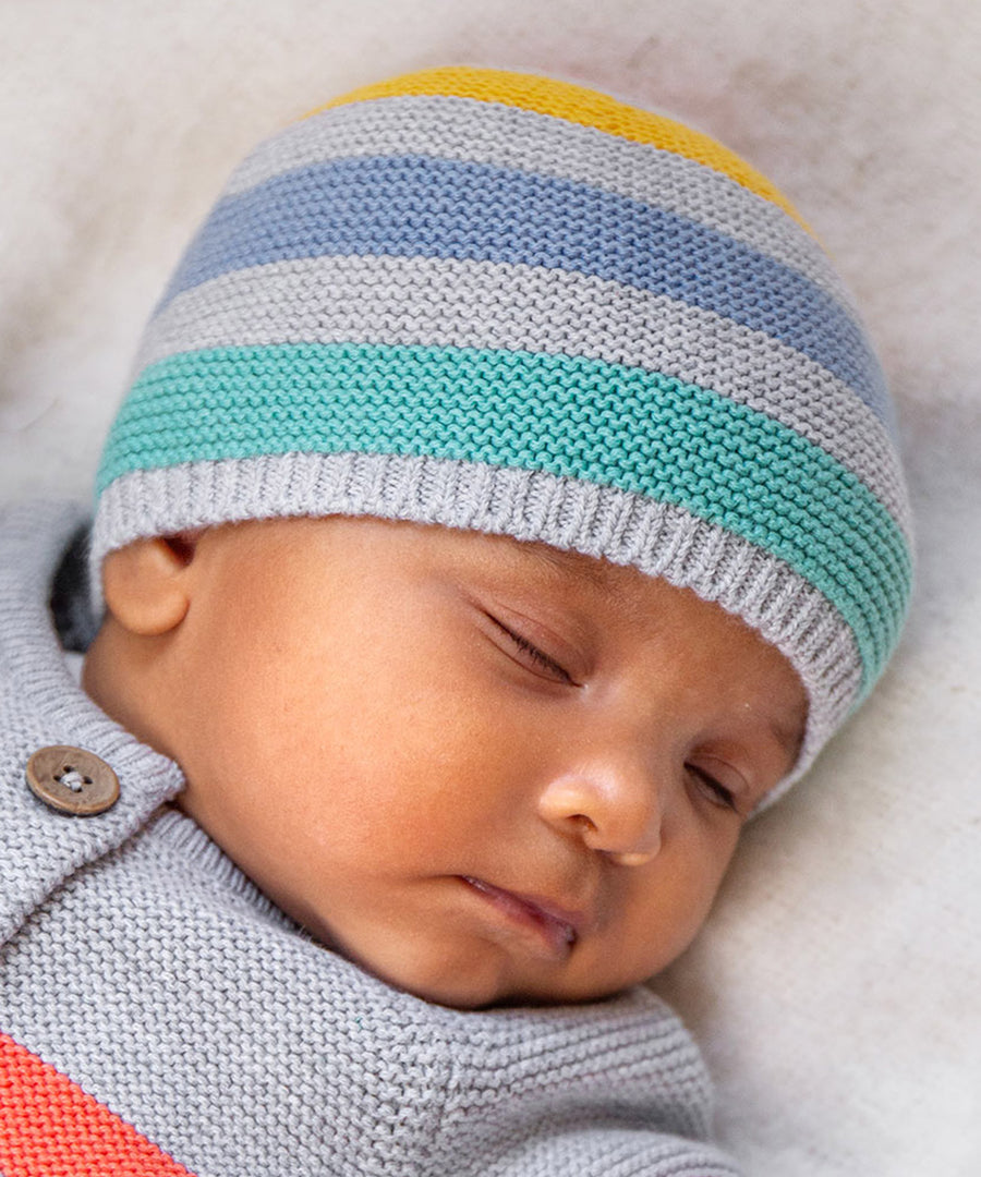 A baby wearing the Frugi Harlen Knitted Hat - Grey Marl Stripe