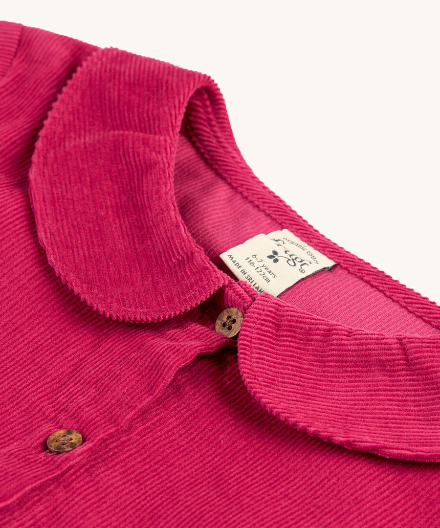 The cord detail, buttons and collar on the Frugi Coco Cord Dress - Lingonberry/Squirrel