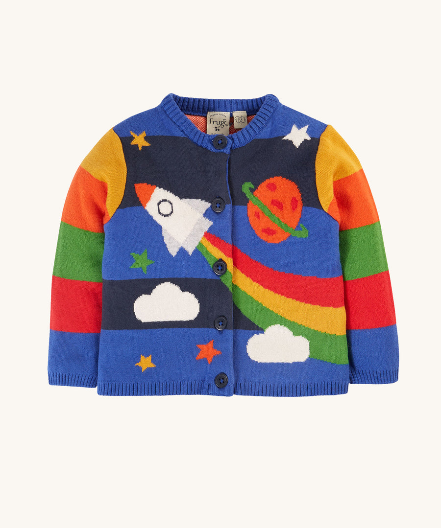 This long-sleeved Corin Knitted Cardigan from Frugi, made from soft organic cotton, In a Rocket Flight design, this cardigan has stretchy rib cuffs and button fastenings running down the front. The print has colourblock stripes, a rocket, stars, a planet and clouds, continued on the back of the cardigan.