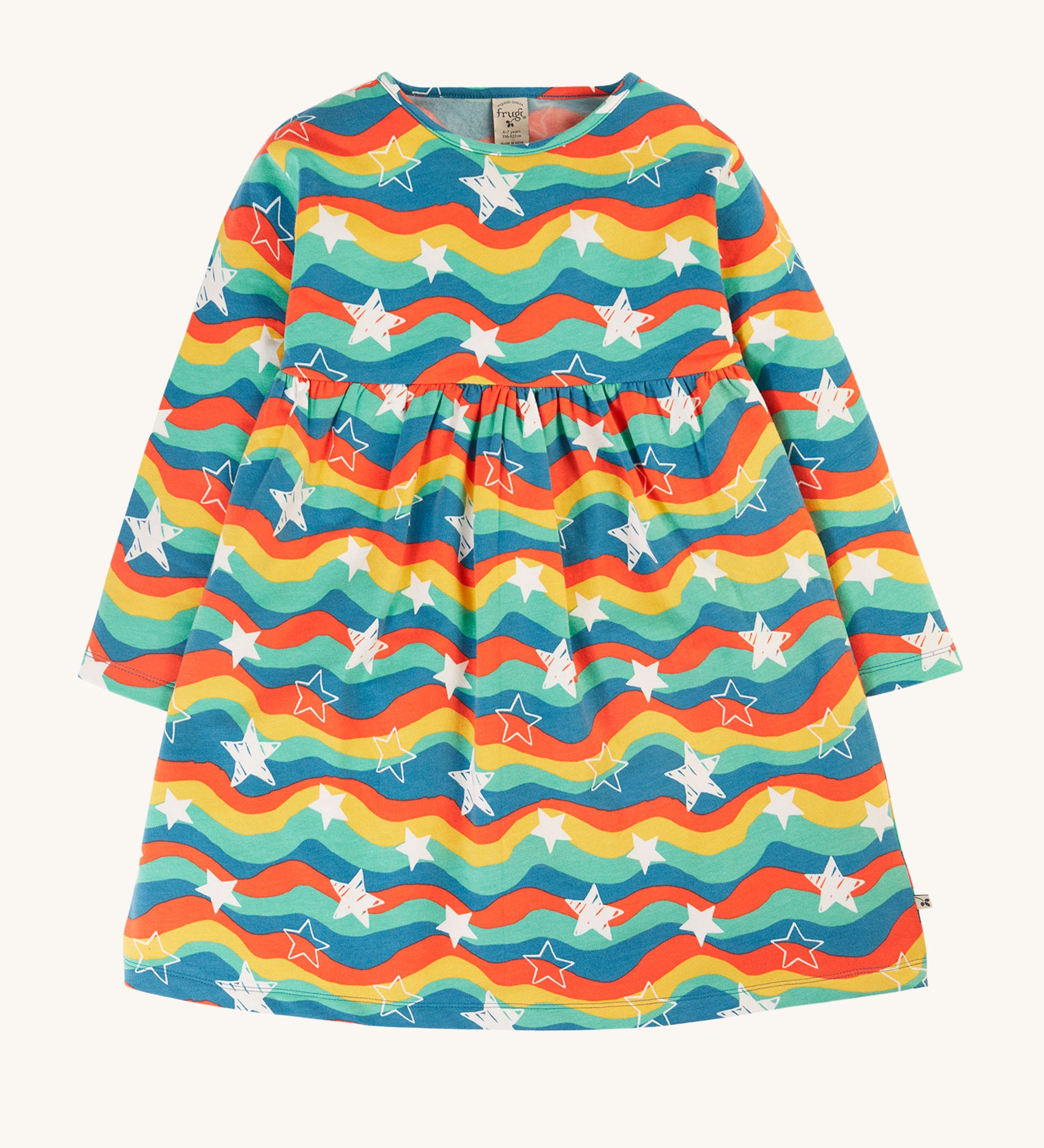 This long-sleeved Amelia Dress from Frugi is made from super soft, lightweight and stretchy brushback fleece, perfect for keeping kids comfy and warm during any adventure. In Wavy Stars print, this kids' dress has gathers around the waist and poppers on the back for easy dressing.