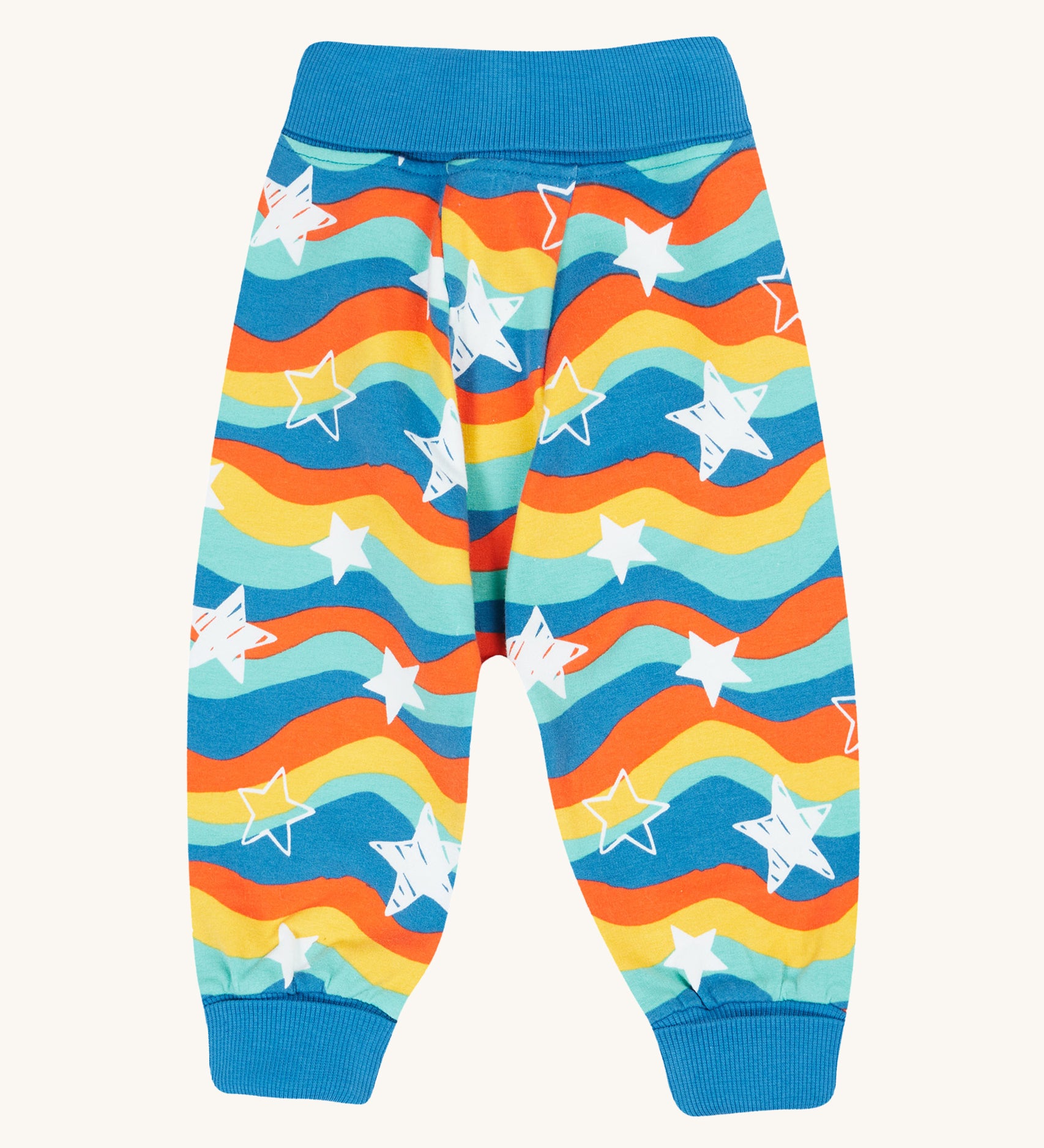 Frugi Cosy Parsnip Pants - Wavy Stars/Protect Your Planet. Made from comfy, organic cotton to fit over cloth nappies, these bottoms have long elasticated rib cuffs that unfold, and have colourful rainbow waves stripes with white stars all over