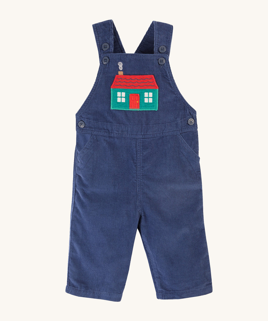 Frugi Durgan Cord Dungarees - Navy Blue/Winter Cottage. Made from organic cotton cord in Navy Blue. With a Winter Cottage embroidery on the chest pocket, and adjustable button fastening shoulder straps, button fastenings on the sides and pockets on the front.