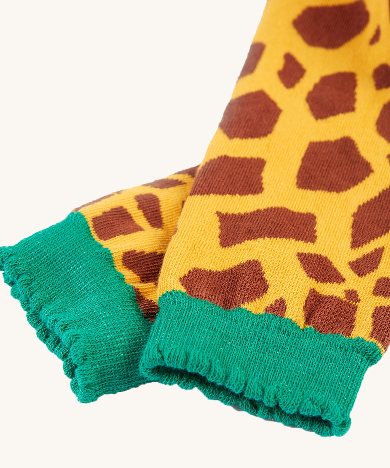 A closer look at the legs and ankle cuffs on the Frugi Little Knitted Leggings - Giraffe