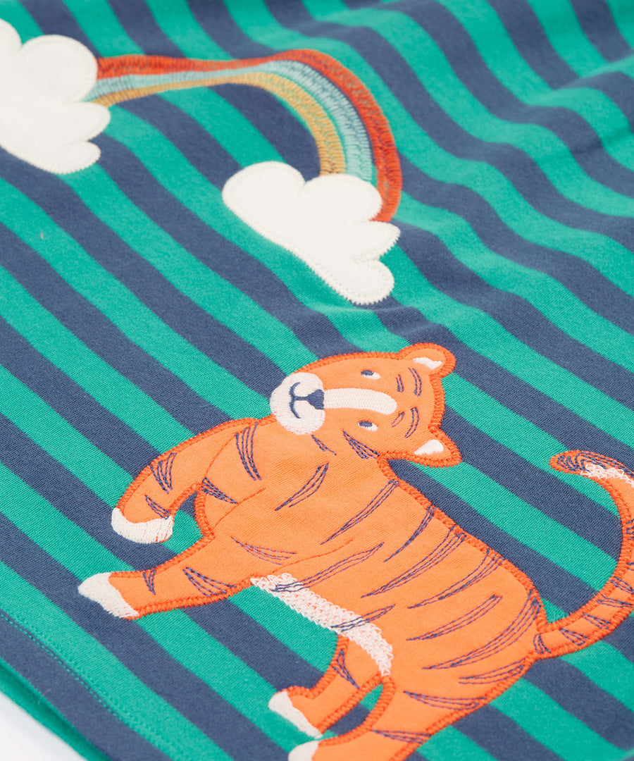 A closer look at the tiger and rainbow detail on the Frugi Dolcie Dress - Iguana Stripe/Tiger