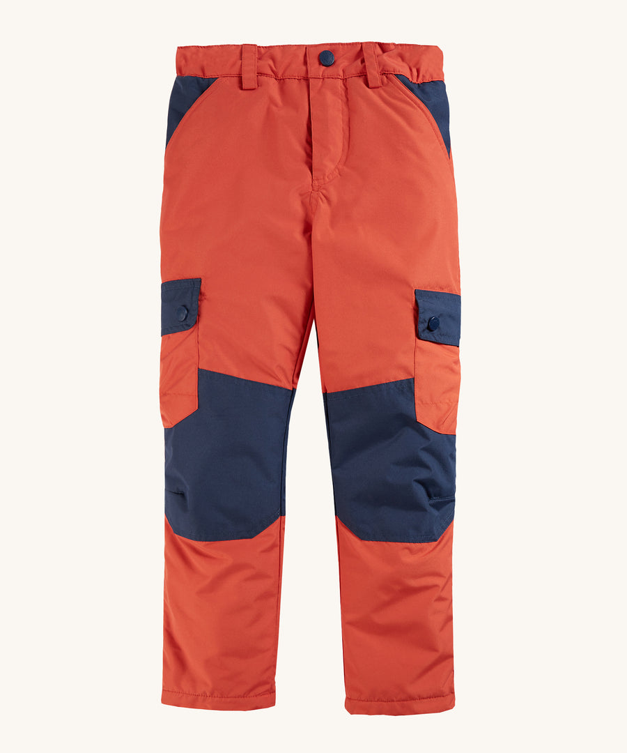 Frugi Expedition Trousers - Paprika / Indigo on a plain background.