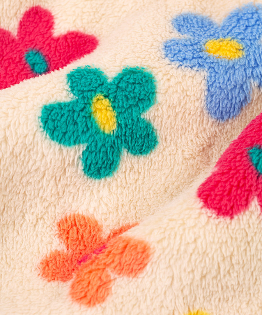 A closer look at the colourful flower pattern and cream fleece, on the Frugi Zipped Ted Fleece Jacket - Flower Pop