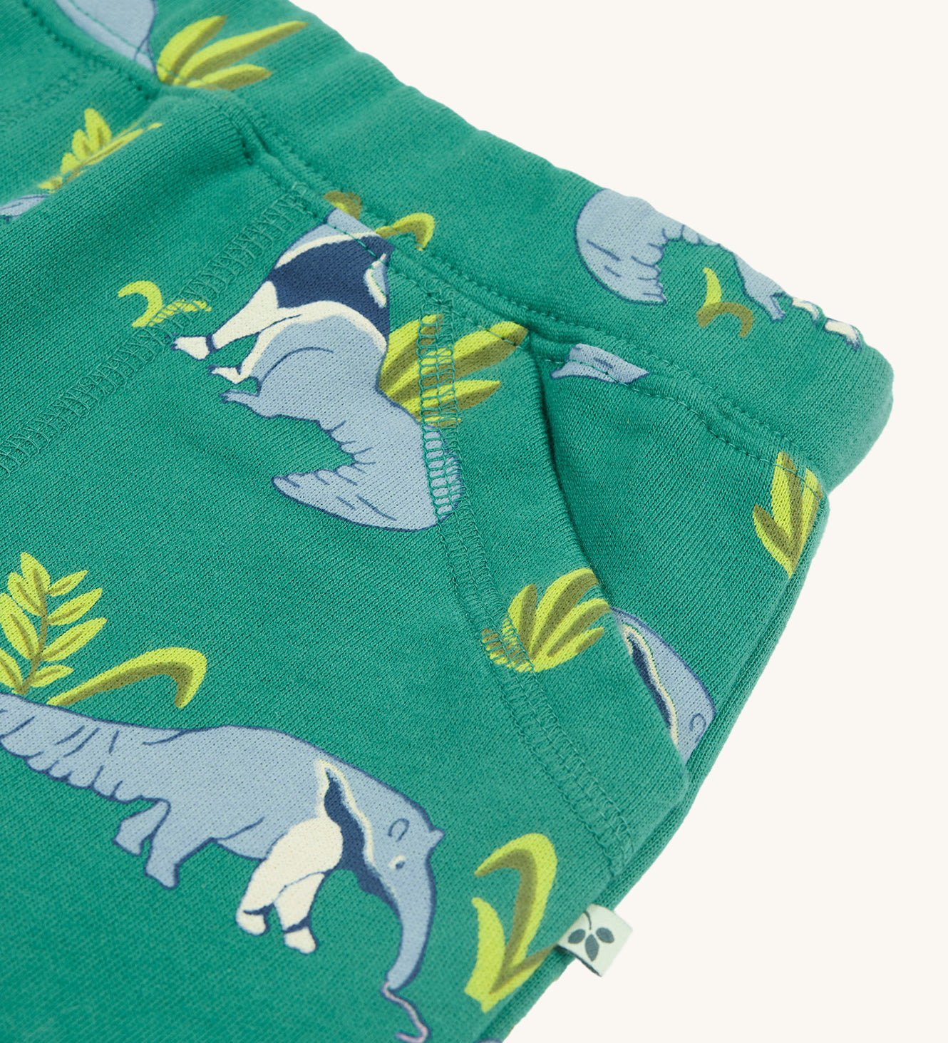 A closer look at the pockets on the Frugi Malpas Joggers - Anteater Parade. The image shows the stitching detail and the adorable anteater print