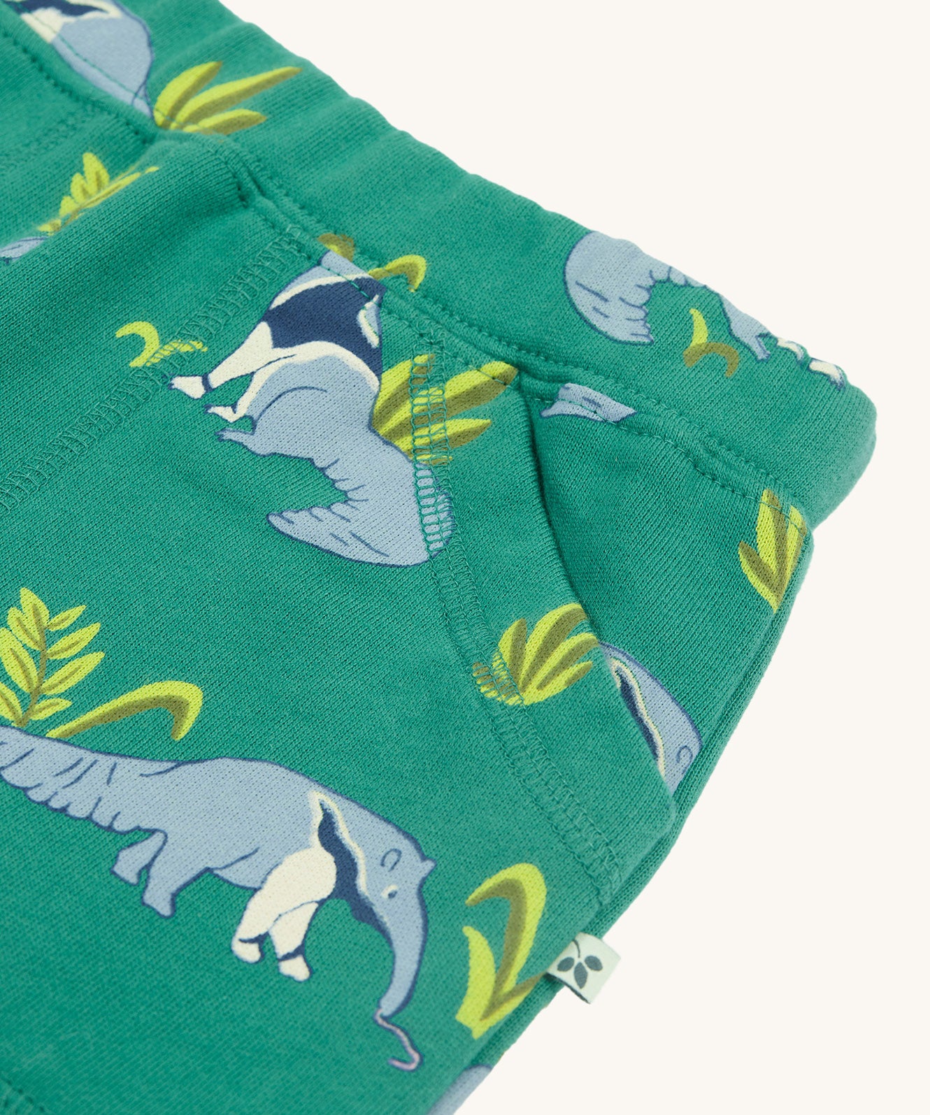 A closer look at the pockets on the Frugi Malpas Joggers - Anteater Parade. The image shows the stitching detail and the adorable anteater print