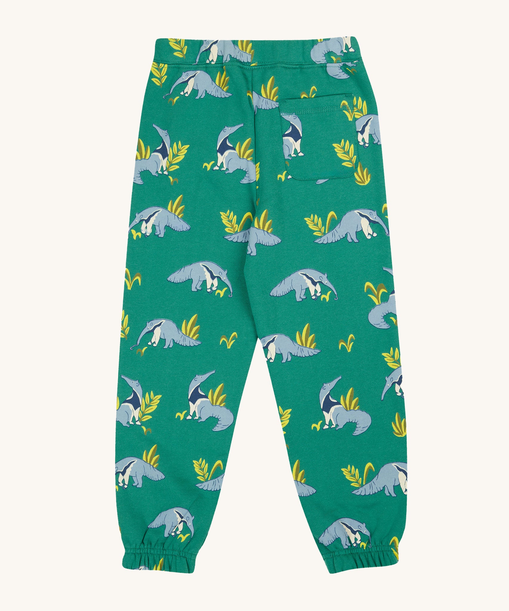 The back of the Frugi Malpas Joggers - Anteater Parade, with the repeat anteater and leaf print, and pocket