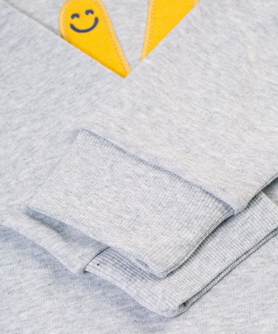 A look at the sleeves on the Frugi Owen Top - Grey Marl/Peace