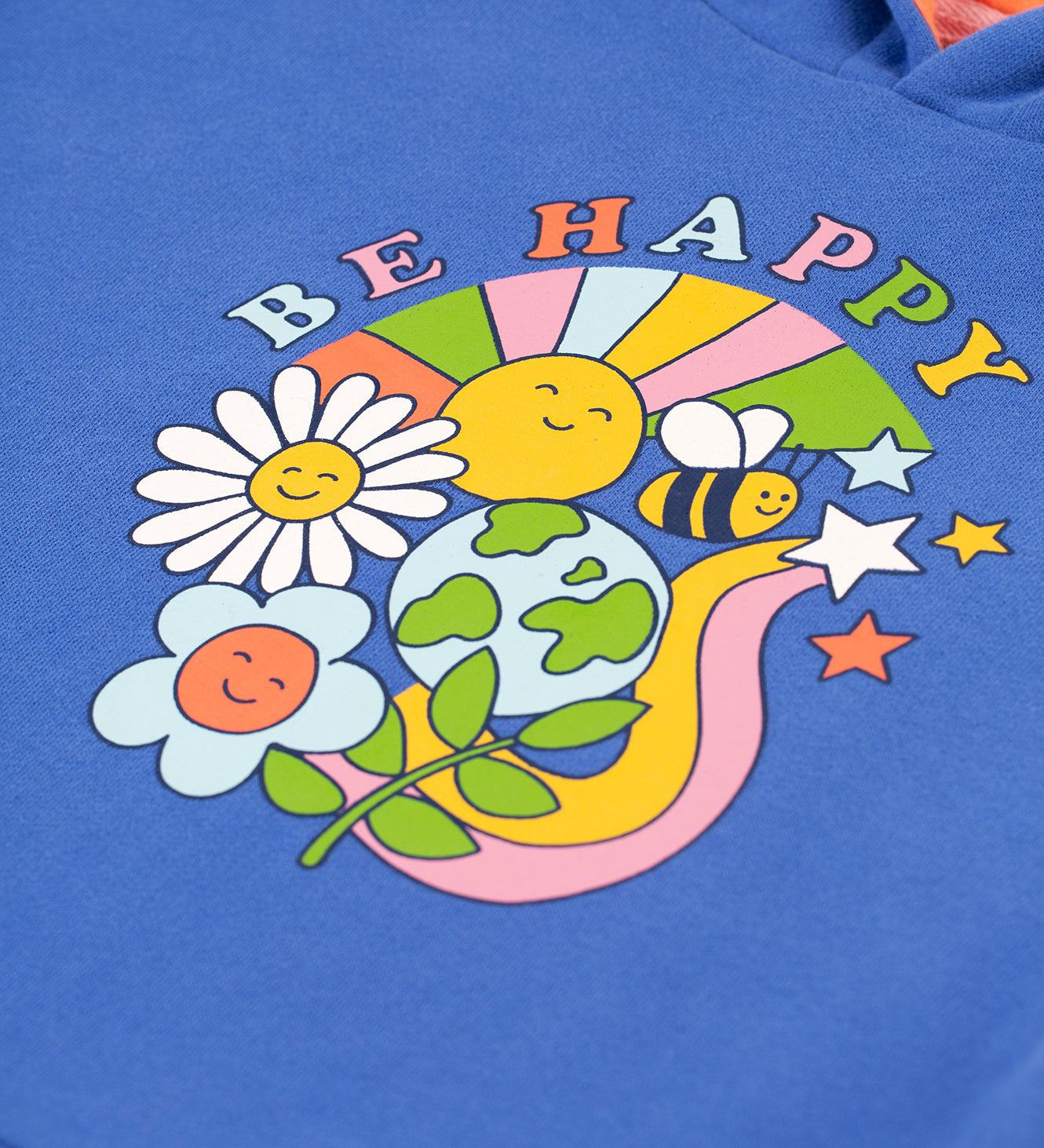 A closer look at the Be Happy print on the front of the Frugi Lissie Oversized Hoodie - Blue Tang/Be Happy. This includes a bee, planet earth, a plant, a rainbow, smiling flowers and a smiling sun with the words "Be Happy" above on soft, blue fabric.