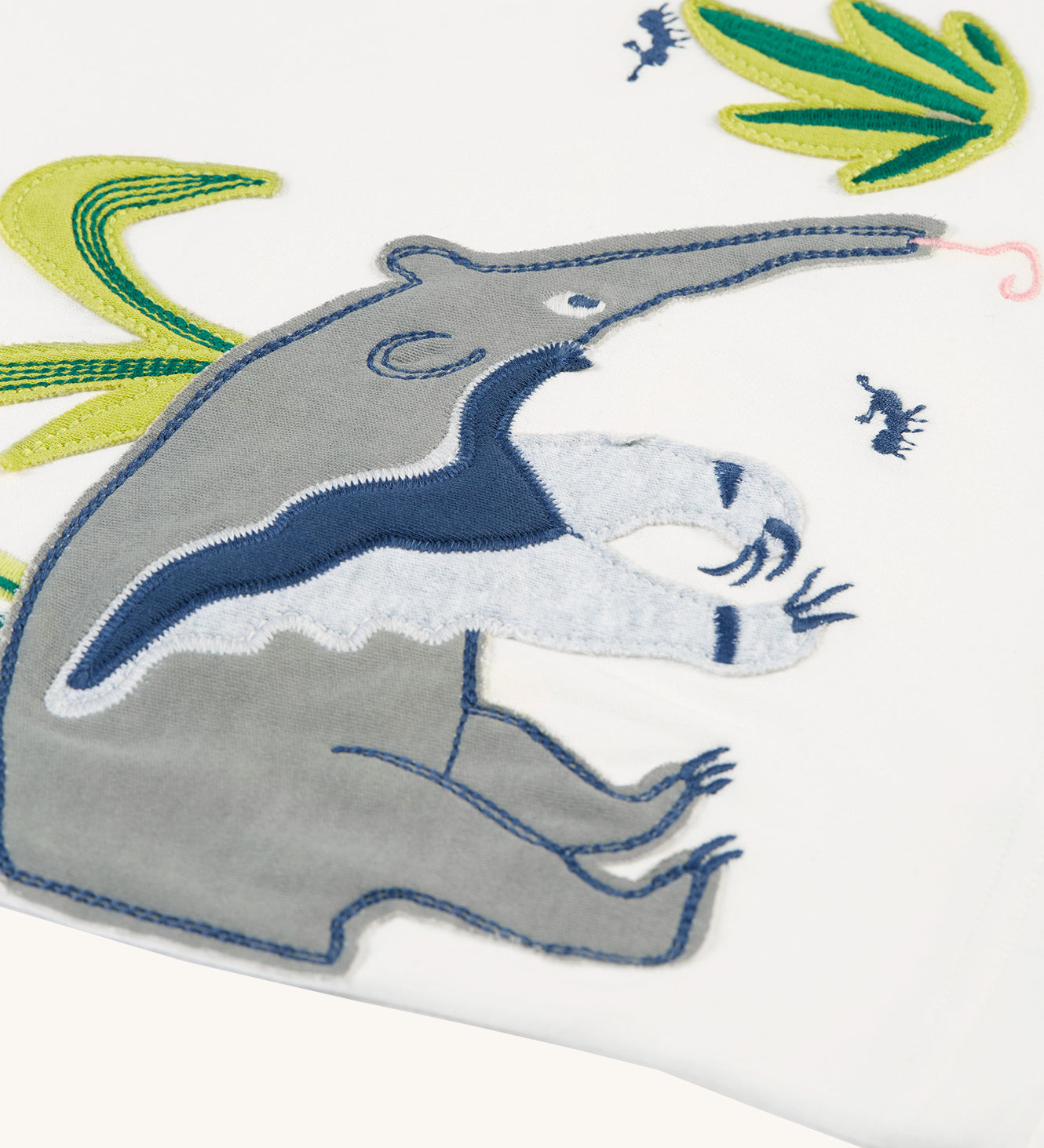 A closer look at the anteater applique on the Frugi Alfie Raglan Top - Navy Blue/Anteater