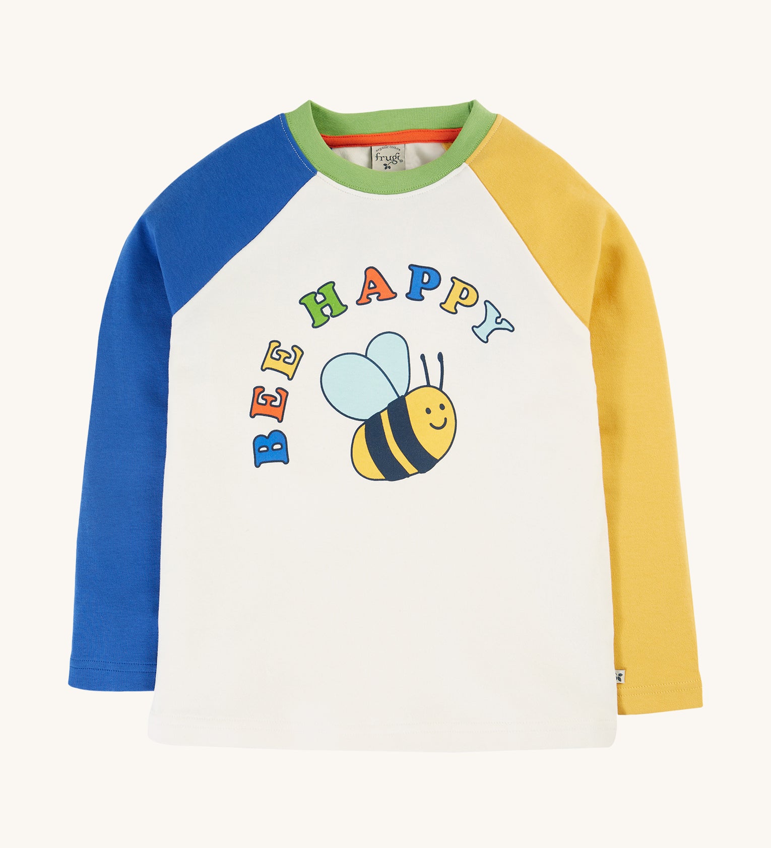 Frugi Tamar Raglan Top - Soft White/Bee Happy. A colourful, raglan top with one yellow and one blue sleeve, a green collar, a white body with a cute bee print and the words "Bee Happy" printed above