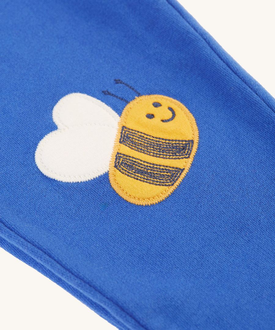 The bee applique on the Frugi Character Crawlers - Blue Tang/Bee