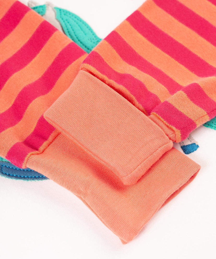 A closer look at the adjustable wrist cuffs on the Frugi Jamie Jim Jams - Cantaloupe Stripe/Horse