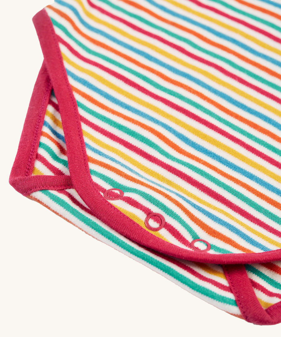 A look at the popper fasteners on the bottom of the Frugi Betty Body - Lingonberry Multi-Stripe