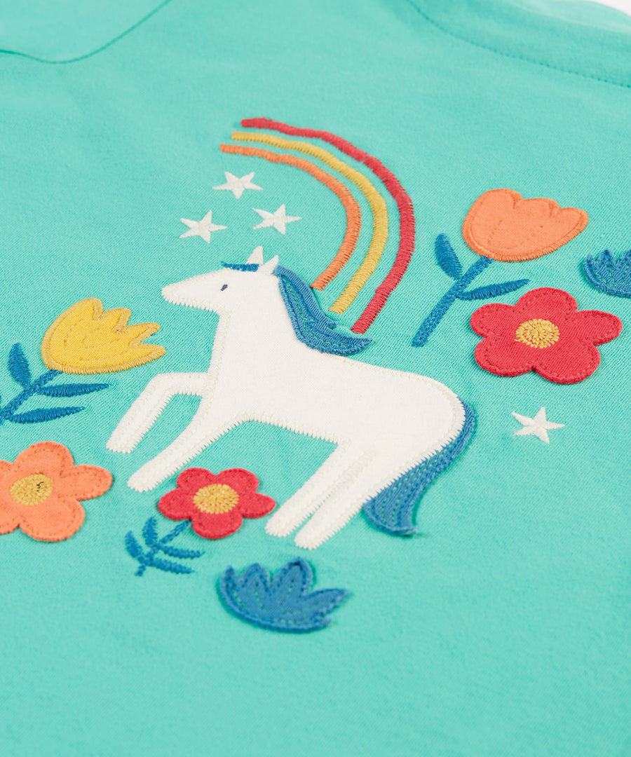 A closer look at the horse and flower applique on the Frugi Anna Applique Top - Pacific Aqua/Horse