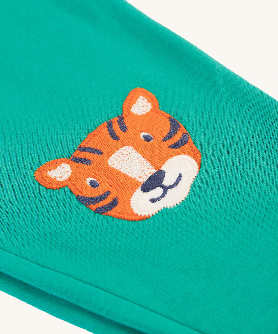 A closer look at the tiger patch on the Frugi Character Crawlers - Iguana/Tiger