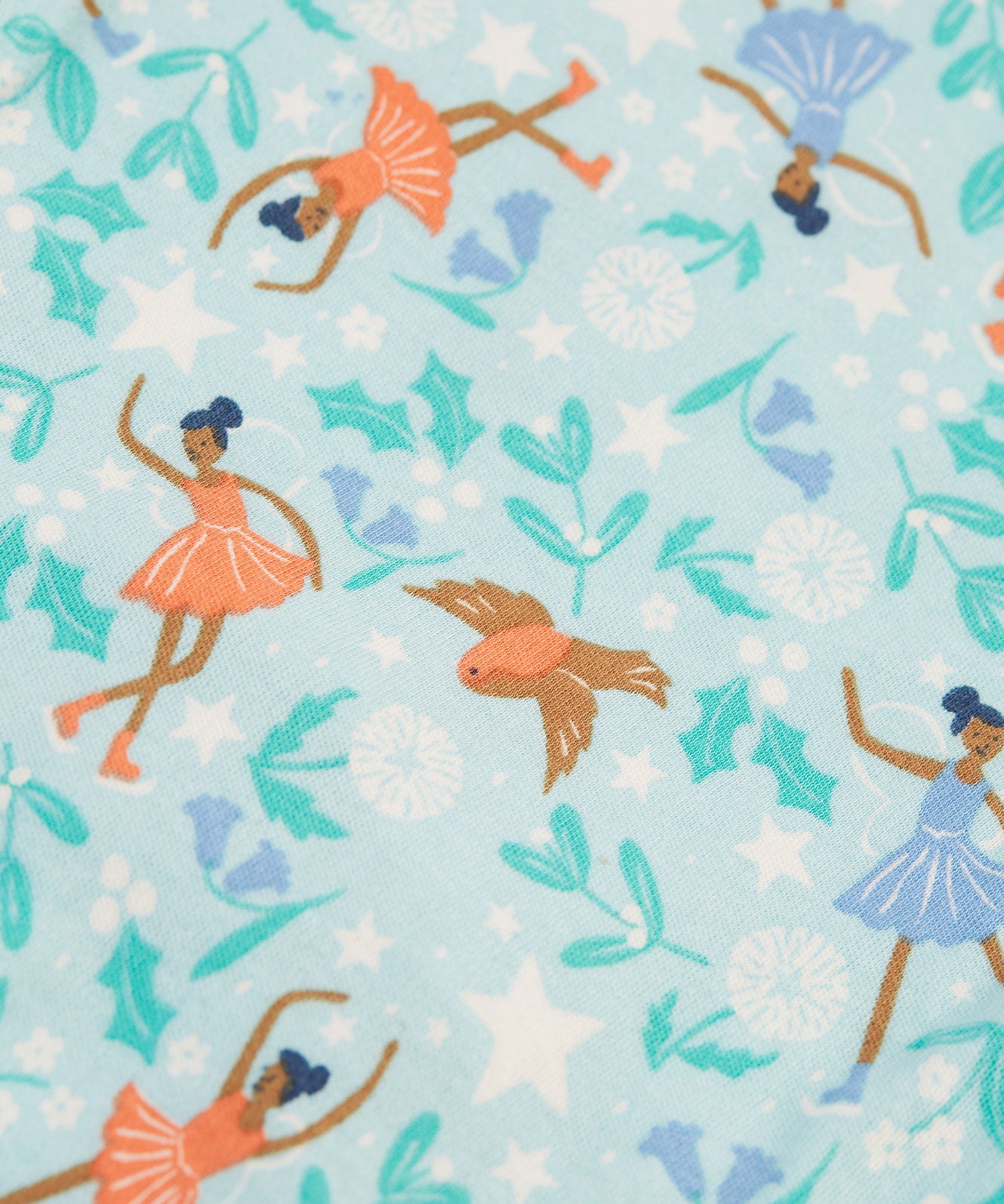 The print of the Frugi Easy Dressing Printed Babygrow - Enchanted Forest consists of flying robins, ice skating fairies, plants and flowers, on a light blue fabric