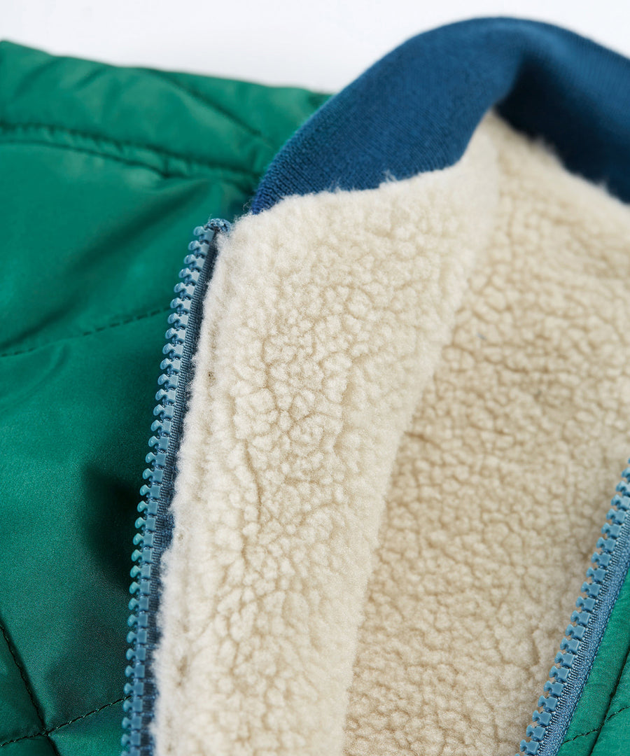 A look at the fleece and zipper on the Frugi Robin Reversible Quilted Jacket - Teal/Moon