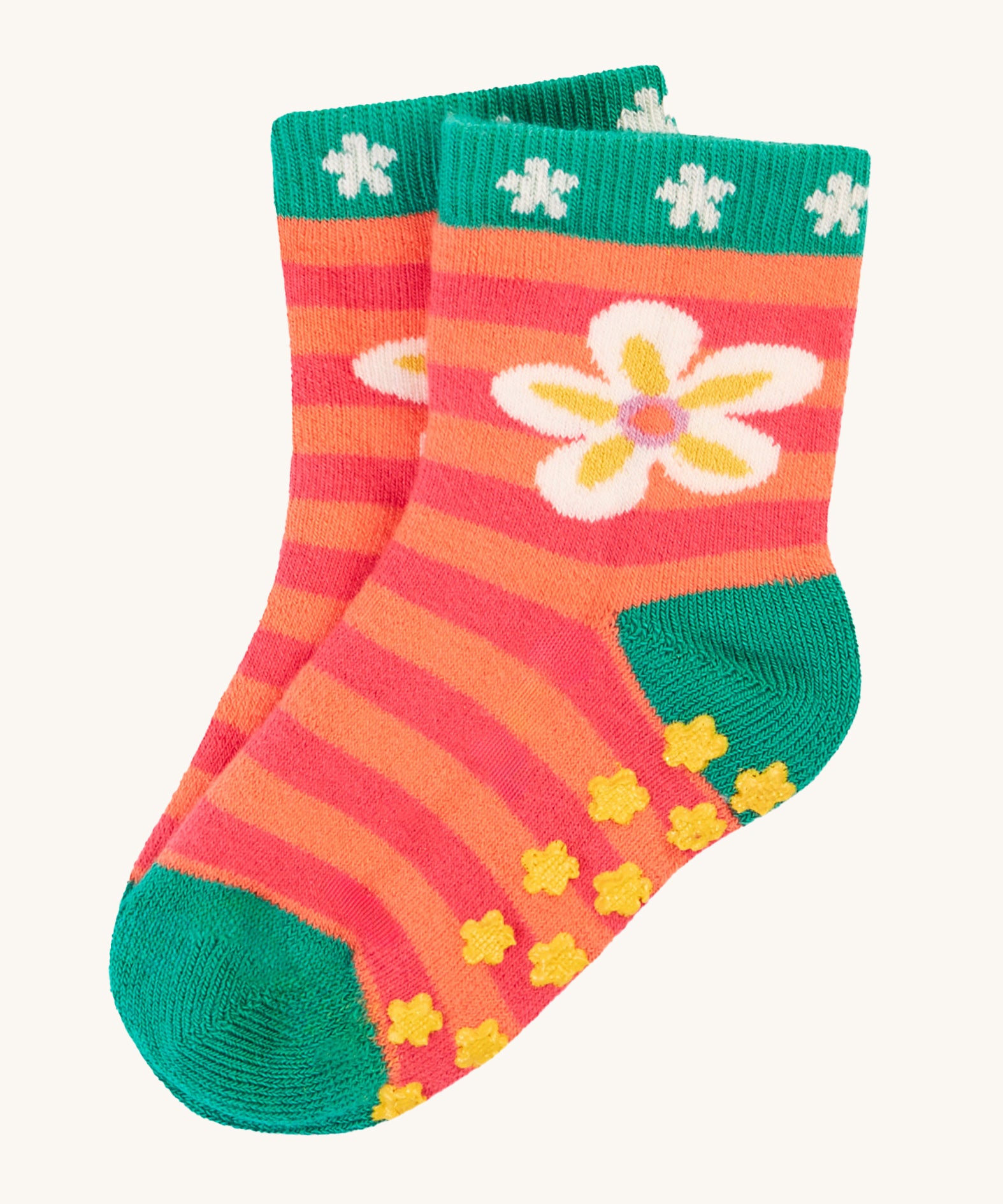 The flower print of the Frugi Grippy Socks 2 Pack - Giraffe. Showing the yellow grippy dots at the bottom of the socks