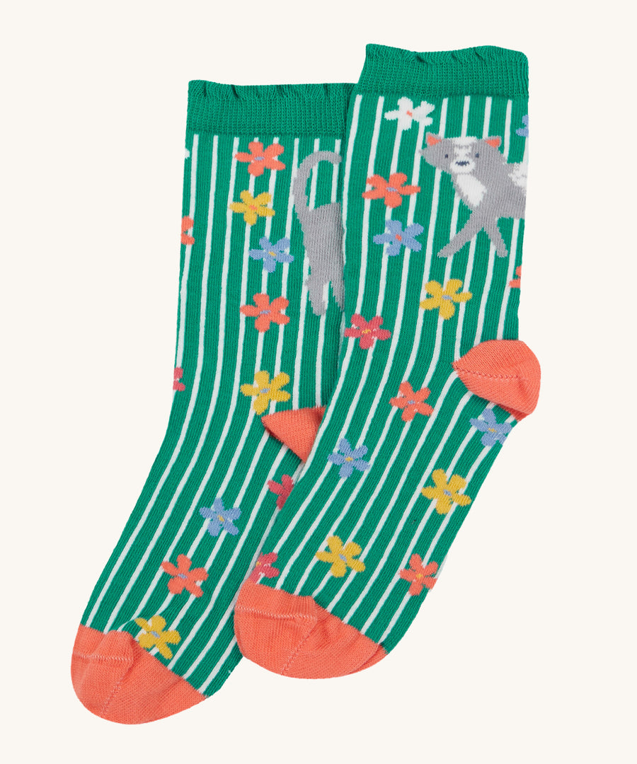 The green stripe and cat with flowers print of the Frugi Frill Socks 2 Pack - Get Outside