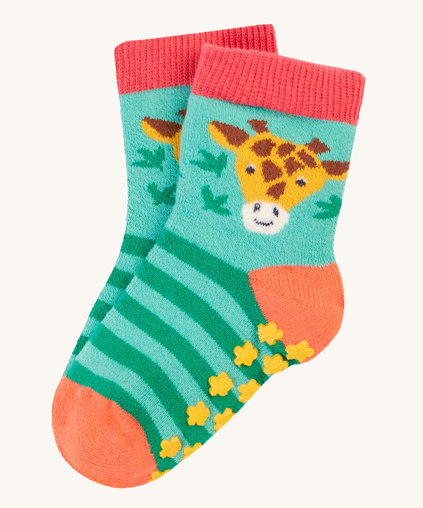 The giraffe print of the Frugi Grippy Socks 2 Pack - Giraffe, showing the yellow grippy dots on the bottom of the socks