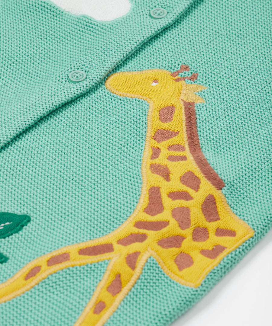 A closer look at the giraffe applique on the Frugi Colby Cardigan - Moss/Giraffe