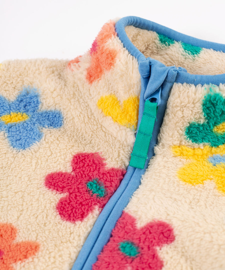 A closer look at the neck and zipper on the Frugi Zipped Ted Fleece Jacket - Flower Pop